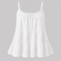 White tiered cami top with adjustable spaghetti straps and front tie detail, front view