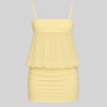 A pale yellow two-piece swimsuit featuring a sheer mesh peplum top with spaghetti straps and a ruched, bodycon mini skirt, shown against a solid gray background.