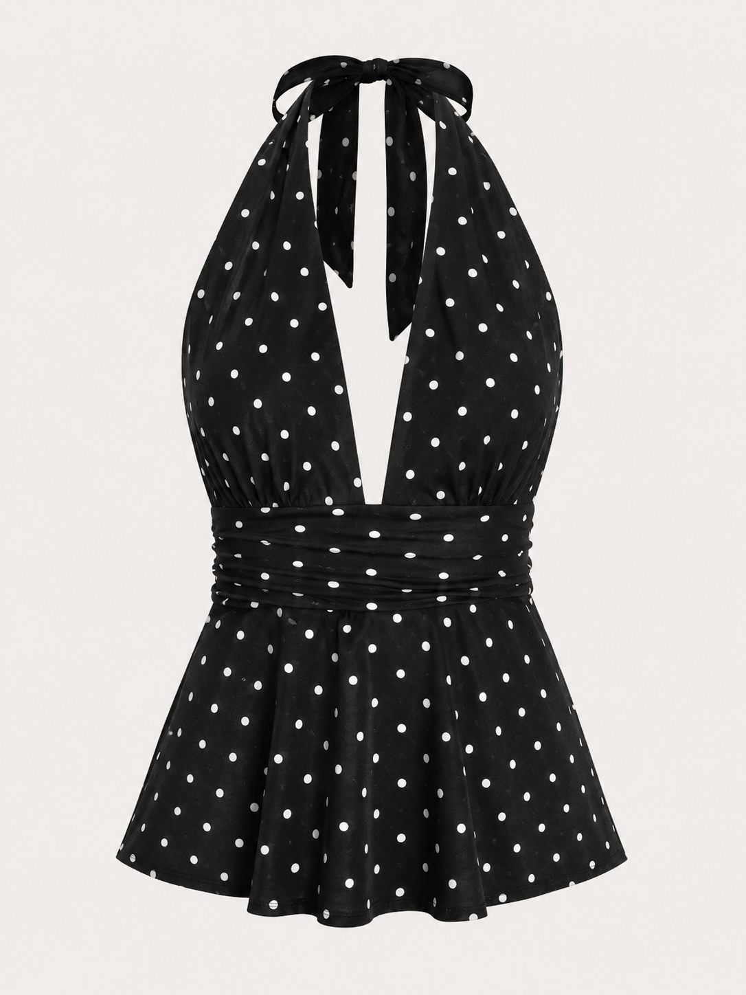 A black halter-neck dress with a white polka dot pattern, featuring a tie-neck design and a flared skirt, shown against a light beige background.